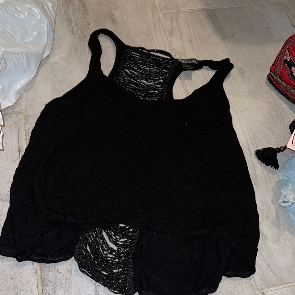 Super cute black tank with cut out back!